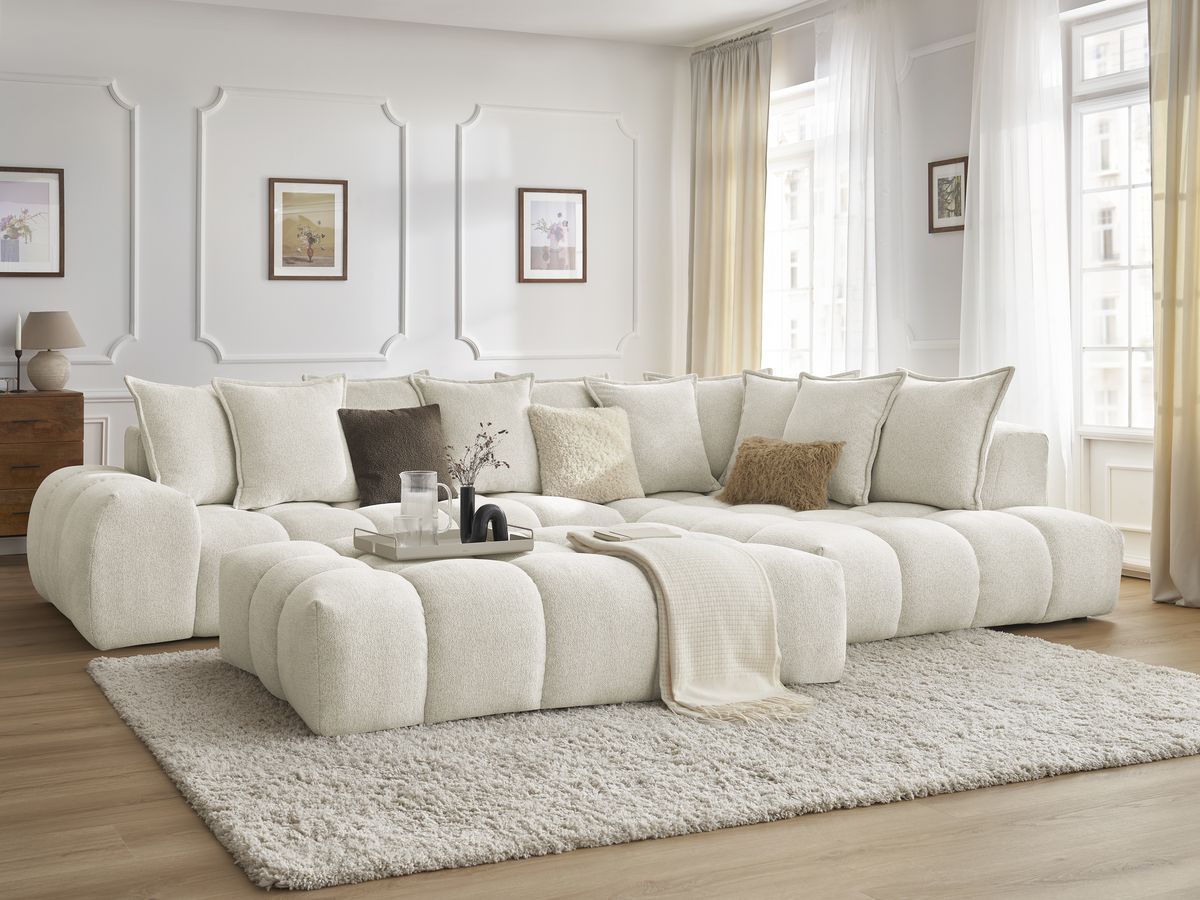 The Panoramic Sofa Accessorized With a Pouf 