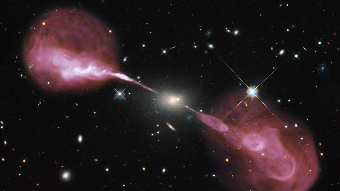 This image of the elliptical radio galaxy Hercules A also comes from NASA's Hubble Space Telescope.  The galaxy is 2.1 billion light-years away and is located in the constellation Hercules.  Huge plasma jets can be seen, which are probably powered by a supermassive black hole in the interior of the galaxy.