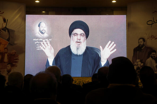 People watch Hezbollah leader Hassan Nasrallah's speech in Baalbek, Lebanon, January 5, 2024.