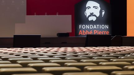 The Abbé-Pierre Foundation logo is installed on stage before the presentation of the association's report on the state of poor housing in France, on February 1, 2023, in Paris.  (VINCENT ISORE / IP3 PRESS / MAXPPP)