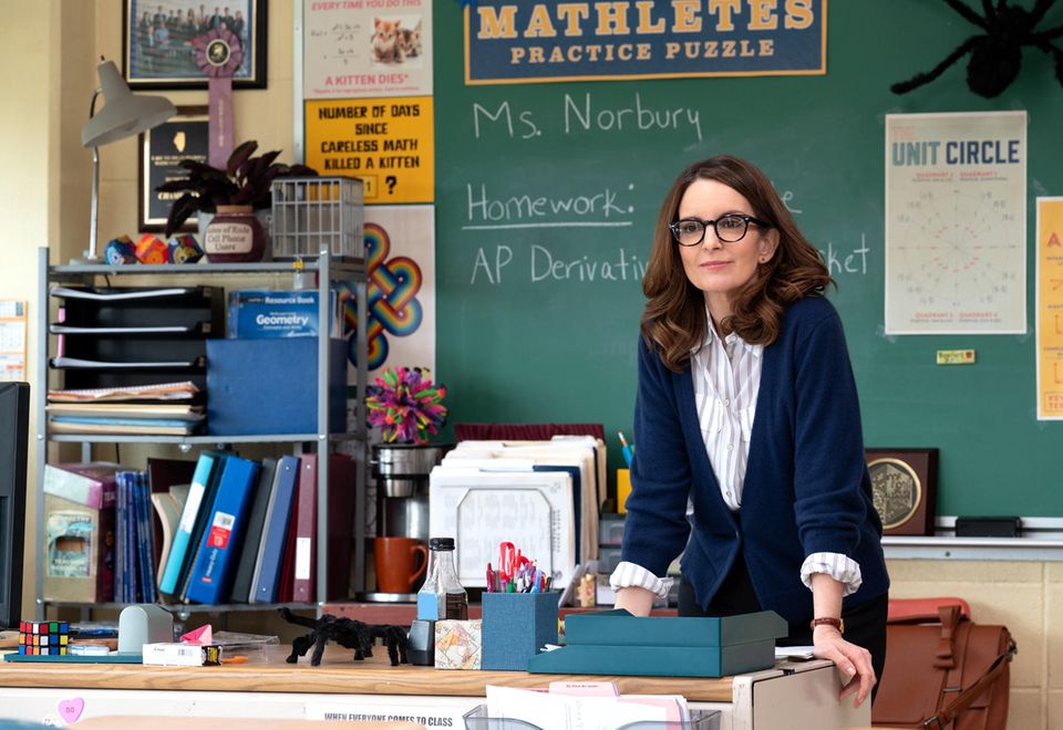Film scene shows Tina Fey as teacher Ms. Norbury standing behind a desk