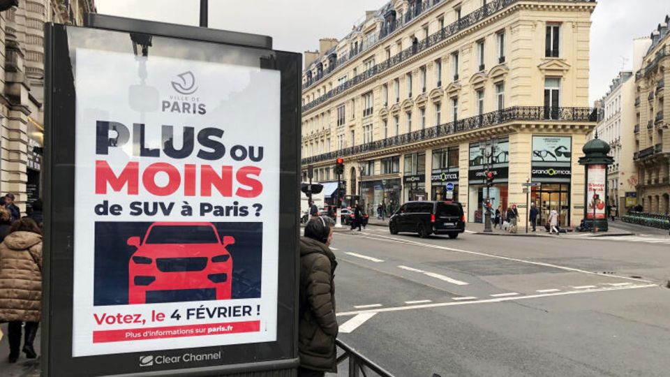 A billboard for the survey on higher parking fees in Paris