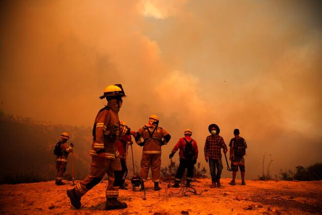 Firefighters in the hills of the municipality of Quilpué, in the Valparaiso region, Chile, February 3, 2024. 