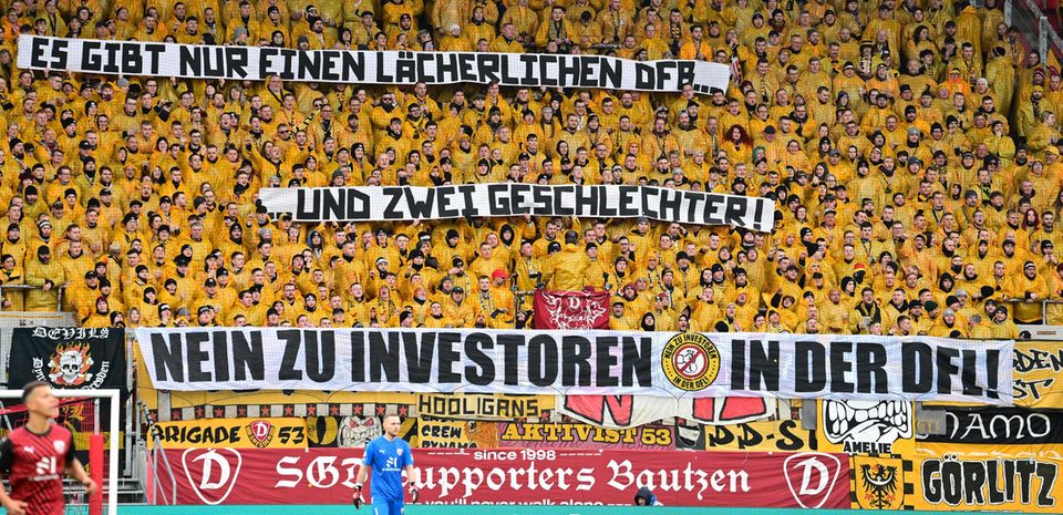 Dynamo Dresden fans hold up a banner that says there are only two genders