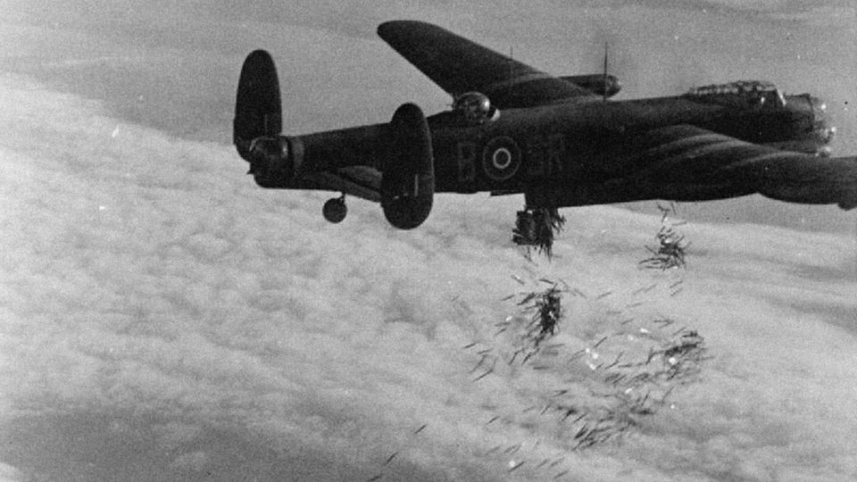 An Avro 683 "Lancaster" of the RAF Bomber Command dropping the strips.