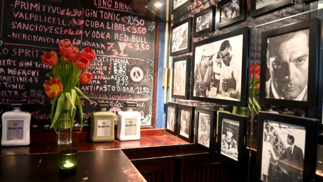 Di Bar: The walls are full of black and white photographs and colorfully written slates.