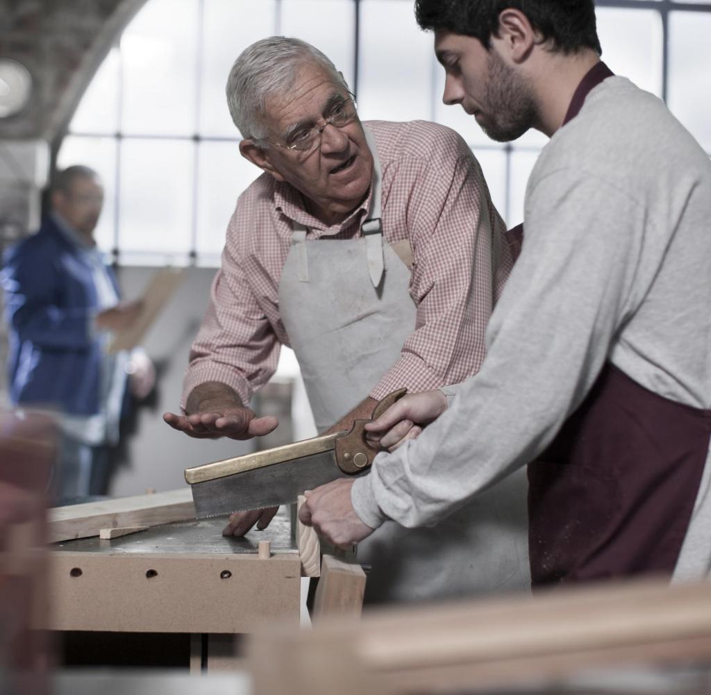 Cape Town, South Africa, young woodworker working together with elderly man in workshop Getty ImagesGetty Images