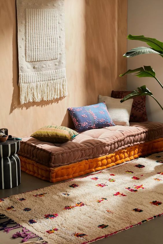   The Ethnic Rug Associated With The Floor Mattress 