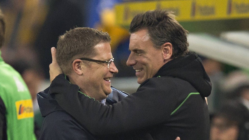 Max Eberl and Steffen Korell hug each other.