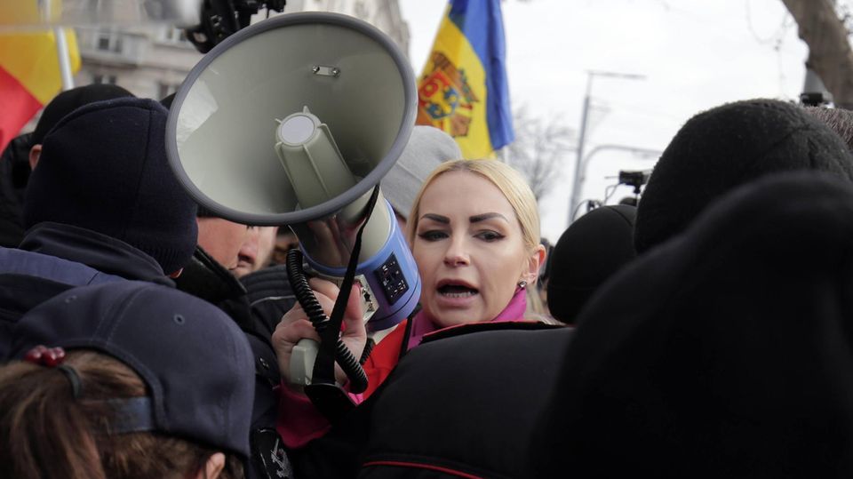 MP Marina Tauber grabs her megaphone at a demonstration in Moldova