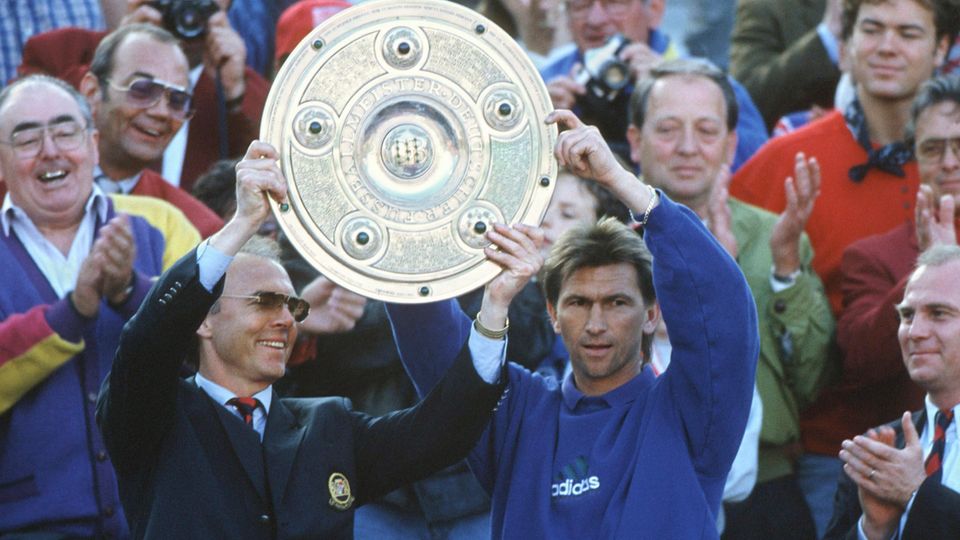 Beckenbauer and Augenthaler hold up the DFB championship trophy in 1994