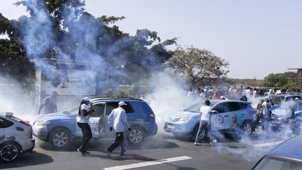 Law enforcement officers fire tear gas against demonstrators denouncing the indefinite postponement of the presidential election, on February 4, 2024 in Dakar (Senegal).  (STEFAN KLEINOWITZ / AP / SIPA)