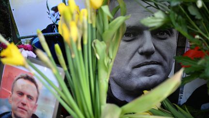Flowers are placed around a portrait of Alexei Navalny at a makeshift memorial in Frankfurt am Main, western Germany, February 29, 2024. (AFP)