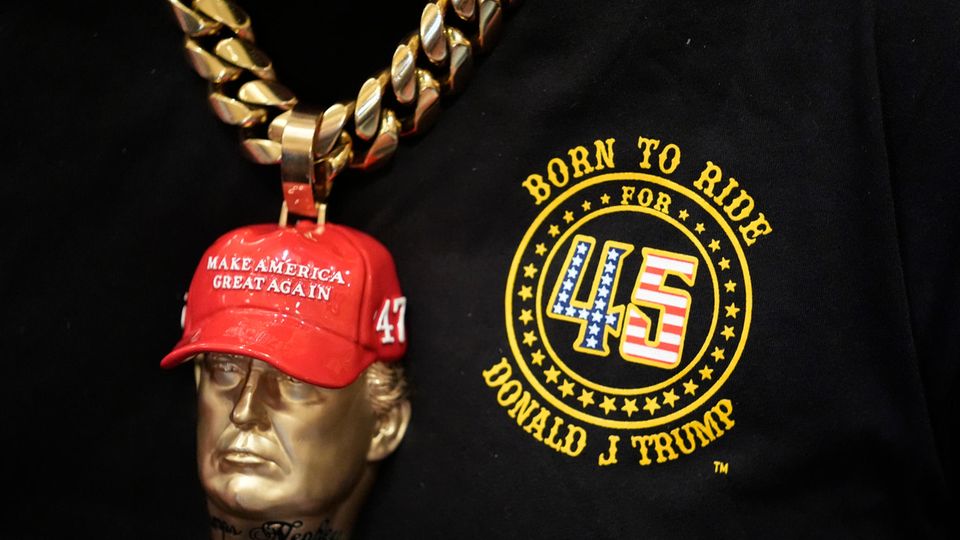 Also does good business with merchandising: Trump as a pendant on a fan's chain