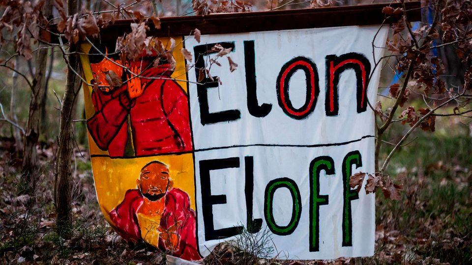 "Elon Eloff" is written on a poster in the protest camp
