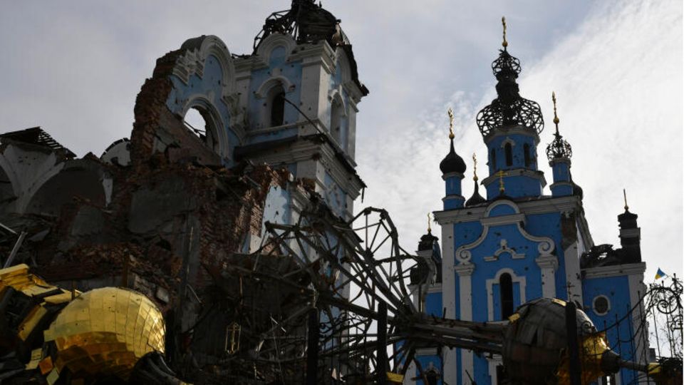 Destroyed domes lie next to a damaged church