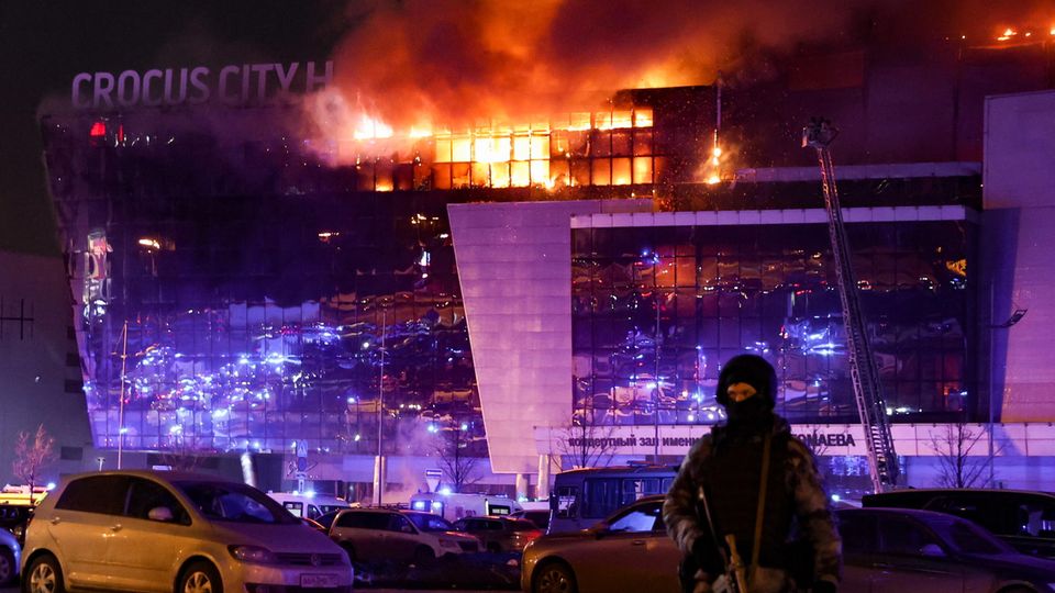 Special forces secure the area around the burning Crocus City Hall in the Moscow suburb of Krasnogorsk