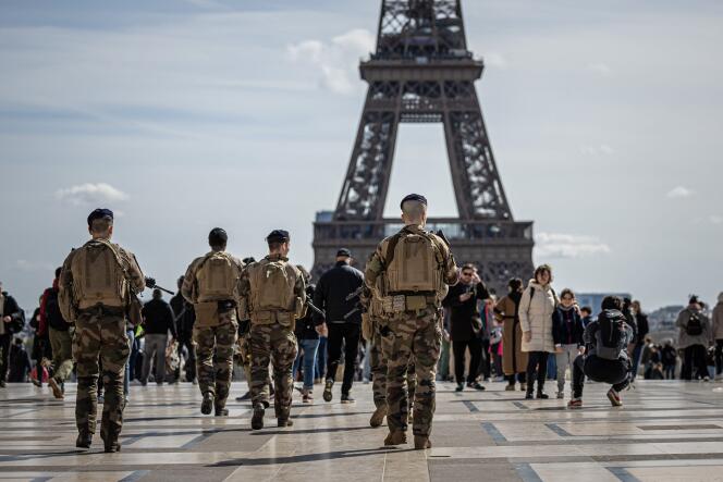 French soldiers patrol near the Eiffel Tower as part of the Vigipirate plan, in Paris, March 25, 2024. 