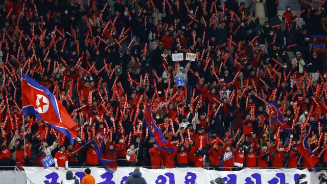Qualifying for the World Cup: A block in Tokyo was dressed in the vibrant red of North Korean fans.