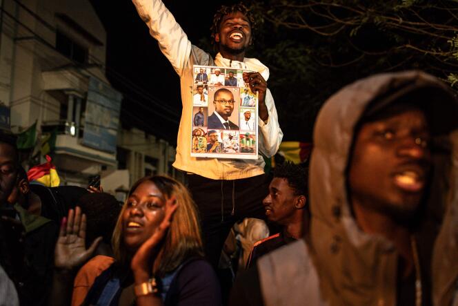 Supporters of Bassirou Diomaye Faye, opposition candidate in the presidential election, during the counting, in front of his campaign headquarters, in Dakar, March 24, 2024.